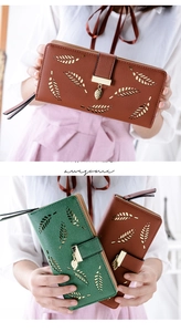 Detail view of hollow leaf pattern and gold leaf pendant on leather long wallets
