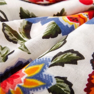 Macro detail of colorful floral print on high-quality cotton linen shawl fabric texture