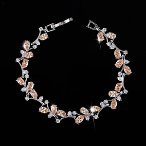 Detail of vine design bracelet with champagne marquise gems and silver plating