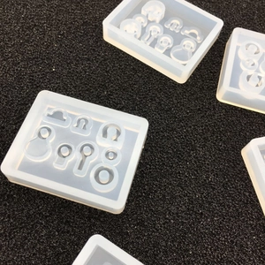 Macro detail of transparent silicone resin molds for DIY jewelry making and galaxy spheres