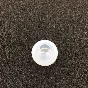 Macro view of a spherical silicone mold for resin casting with a round top opening