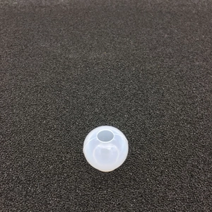 Top-down view of a translucent spherical silicone resin mold for creative DIY crafts