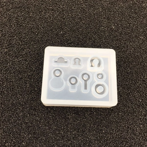 Detail of translucent silicone DIY mold with multiple geometric shapes for jewelry making