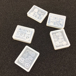 Top view of five translucent silicone resin molds for DIY jewelry pendant making