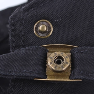 Black canvas flat cap with vintage bronze star buckle and detailed metal embroidery