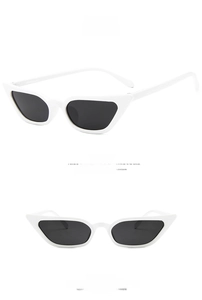 White cat eye sunglasses with dark gray lenses showing front and side view angles