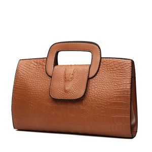 Brown crocodile embossed faux leather handbag with rectangular handle and relief detail
