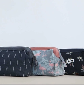 Three-piece flamingo and floral print cosmetic storage bags for travel organization