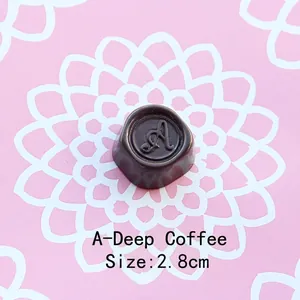 Detailed view of 2.8cm dark coffee resin chocolate charm with relief letter A