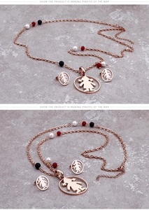 Close-up of rose gold girl pendant necklace and stud earrings set with colorful beads