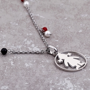 Silver titanium steel necklace with girl pendant and colorful beads on stone background