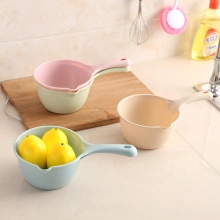 Pastel plastic water ladles in pink, green, beige and blue colors for kitchen use