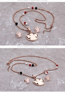 Detailed macro view of rose gold angel jewelry set with colorful decorative beads