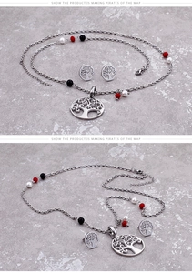Close-up of tree of life jewelry set with colorful beads on polished silver finish