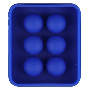 Overhead view of a blue 6-cavity silicone sphere ice mold for making large cocktail ice balls