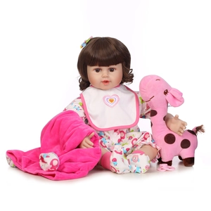 Lifelike reborn baby doll set with brown hair, pink outfit and giraffe plush toy