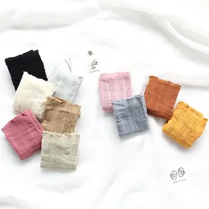 Flat lay of cable knit镂空 socks in a palette of Morandi colors with ruffle edge detail