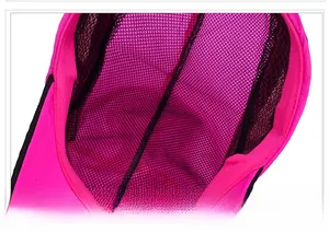 Detail view of pink sun hat featuring black breathable mesh lining and reinforced edging
