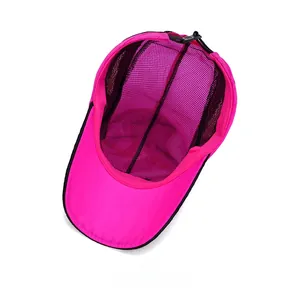 Detail showing breathable black mesh lining and inner construction of a rose pink baseball cap