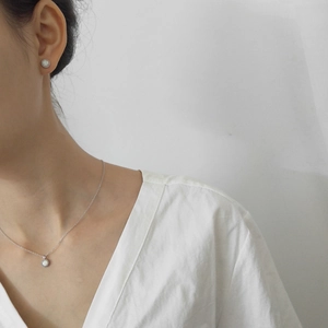 Minimalist s925 silver jewelry set with opal pendants shown on a female model