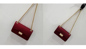 Detailed view of dark red V-quilted faux leather bag with golden chain strap and twist lock