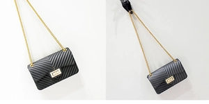 Detail of matte black V-pattern jelly bag with gold chain strap and square buckle