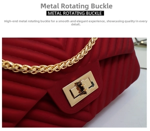 Close-up detail of golden metal rotating buckle and V-shaped texture on matte wine red bag