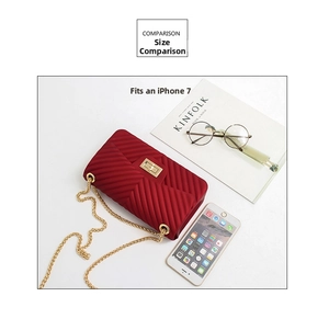 Detailed size comparison of red V-quilted mini chain bag next to an iPhone and accessories