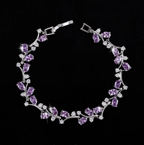 Detailed macro of silver plated bracelet featuring purple oval stones and white zircon accents