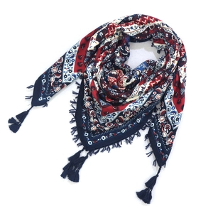 Detail of bohemian scarf with paisley floral pattern and navy blue tassels fringe