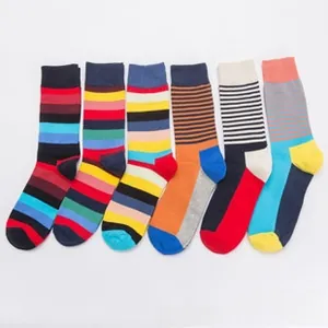 Flat lay of six pairs of colorful striped crew socks with vibrant multi-color patterns