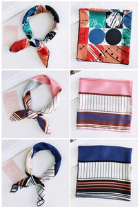Detail showing various geometric print silk scarves in square layout and tied styles