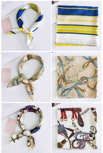 Detail of silk-satin square scarves featuring floral and geometric equestrian prints
