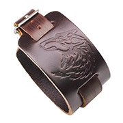 Macro detail of brown leather bracelet featuring an embossed wolf head and buckle strap
