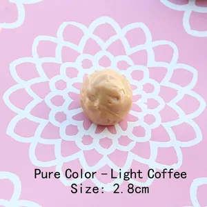 Detail of 2.8cm light brown spherical resin chocolate charm with realistic texture