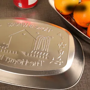European vintage boat-shaped tinplate tray with embossed home and heart motif
