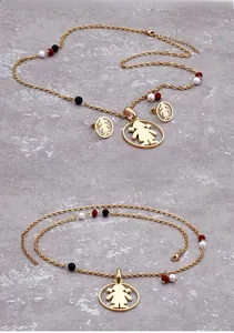 Detailed shot of titanium steel jewelry set with girl logo and colored beads