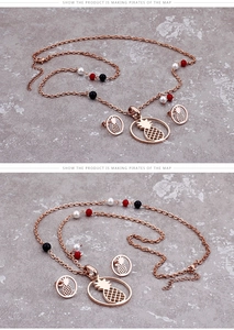 Detail of rose gold pineapple jewelry set featuring colorful beads and hollow charms
