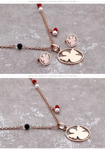 Detail view of rose gold bear pendant jewelry set with colorful beads and stud earrings