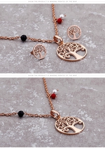 Detail of rose gold tree of life necklace and earrings set with multi-color beads