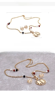 Detailed size specifications for 18K gold plated necklace and earrings with silhouette charm