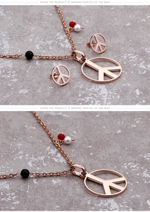 Detail of rose gold jewelry set featuring peace sign necklace with colorful accent beads