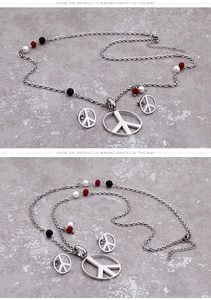 Detail view of peace symbol jewelry set with stainless steel finish and colorful beads