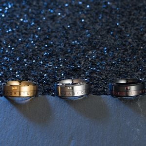 Rotating stainless steel rings with letter engravings in gold, silver, and black finish