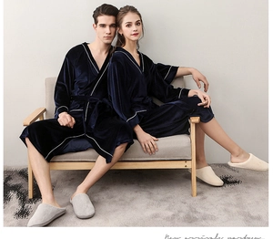 Detail of dark blue velvet couple robes with white piping and matching waist belts