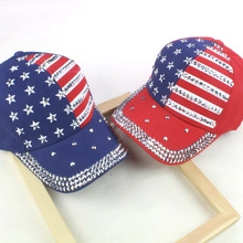 Detailed view of red and blue camouflage baseball caps with American flag and rhinestones
