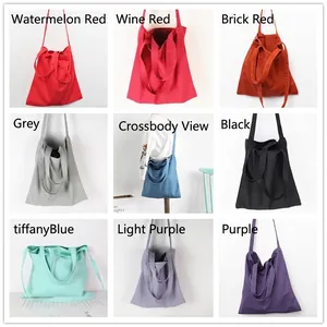 Minimalist canvas tote bags shown in nine colors with dual handles and shoulder strap