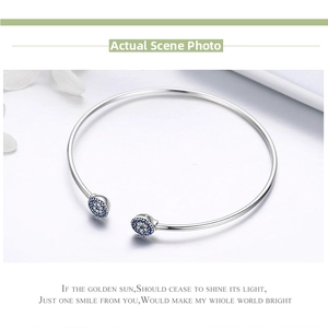 Detail of S925 sterling silver evil eye cuff bracelet with sparkling blue crystals