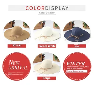 Detail view of woven straw sun hats with ribbon bows and beads in four diverse colors