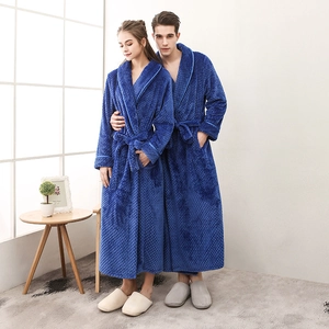 Thick royal blue waffle knit bathrobes for couples featuring a long design and waist tie